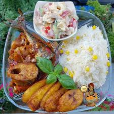 White Rice and stew, salad, plantain, and Titus Fish